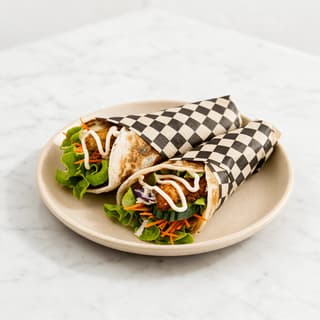 Crispy chicken wraps in checkered paper — kiosk and app menu food photography