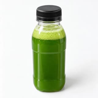 Single tall unlabelled clear plastic bottle of cold-pressed green juice with a plain black screw cap, standing on a seamless white studio background