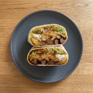 California burrito cross section carne asada french fries cheese — bisected San Diego style hero photography