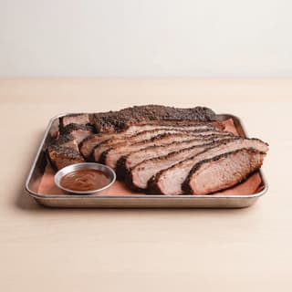 Texas smoked brisket sliced smoke ring bark butcher paper dallas bbq — brisket hero photography