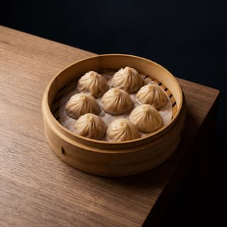 Xiao long bao soup dumplings translucent skin pleated bamboo steamer — Shanghai soup dumpling hero photography