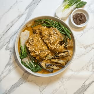 Kare-kare filipino peanut oxtail stew eggplant bok choy bagoong shrimp paste overhead bowl — kare-kare hero photography