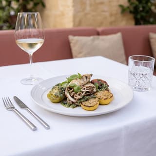 Charcoal-grilled octopus with tarama and sumac — Mediterranean restaurant menu photography