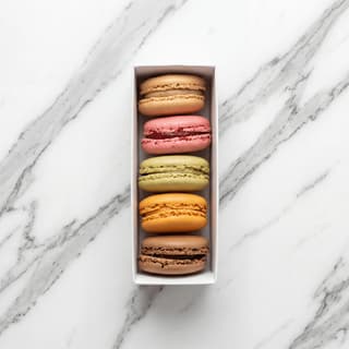 Macarons Parisian rainbow row proper foot pied ganache pastel overhead — macaron hero photography