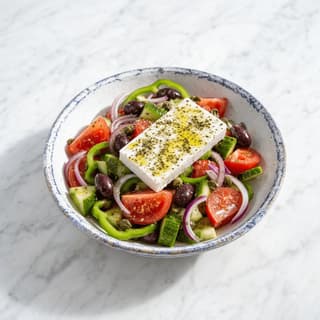 Greek salad horiatiki tomato cucumber feta block olives oregano olive oil bowl — greek salad hero photography