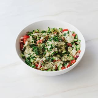 Israeli salad finely diced cucumber tomato parsley lemon bowl — Israeli salad hero photography