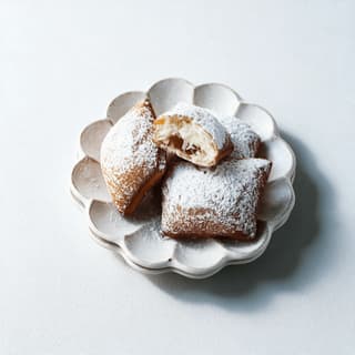 New orleans beignets thick powdered sugar drift square fried dough pillows torn open french quarter — beignets hero photography