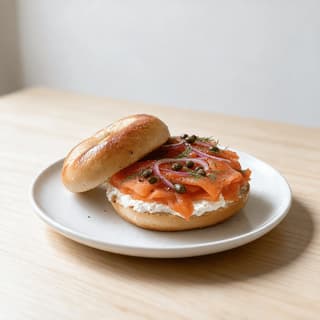 New york bagel and lox dense chewy boiled bagel cream cheese schmear cold smoked salmon ribbons capers red onion dill — bagel lox hero photography