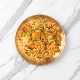 Pakistani biryani Karachi Sindhi style potato saffron rice masala raita overhead — biryani hero photography