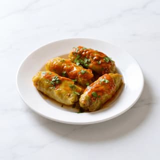 Golabki stuffed cabbage rolls tomato sauce dill plate — golabki hero photography