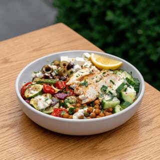 Quinoa grain bowl salad kale roasted vegetables tahini drizzle wooden — grain bowl hero photography