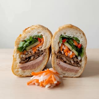 Banh mi vietnamese baguette sandwich cross section pate pork cilantro pickled carrot daikon chili — banh mi hero photography