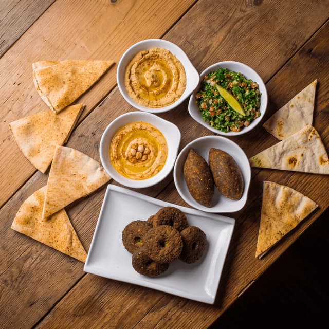Mezze spread of hummus, falafel and tabbouleh from above — restaurant group menu photography