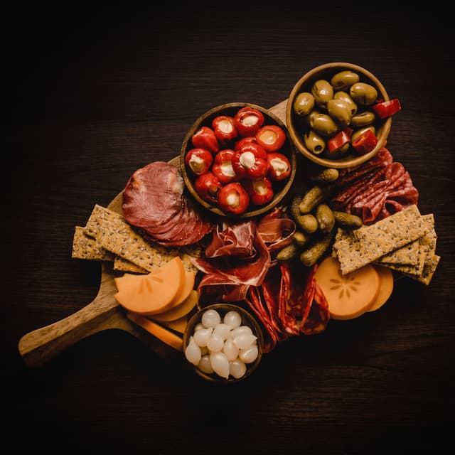Grazing board of cured meats and cheeses from above — catering menu food photography