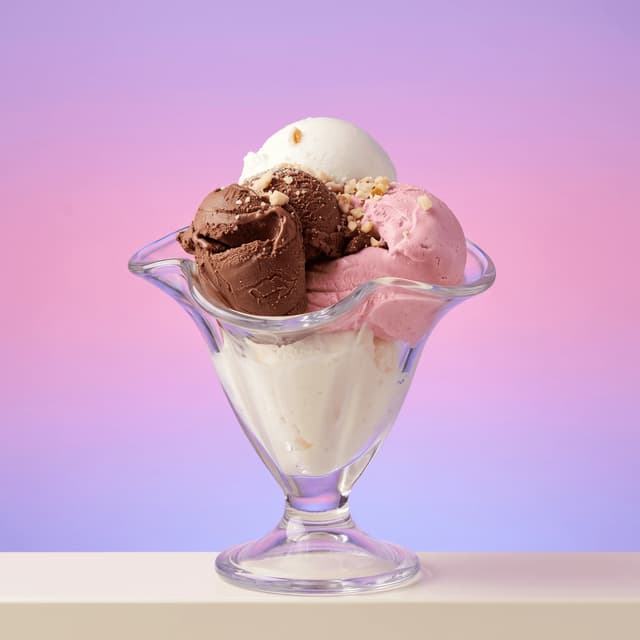 Vanilla, chocolate and strawberry gelato in a glass coupe — ice cream maker product photography