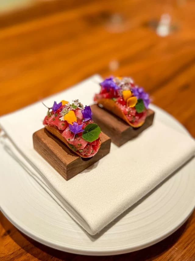 Original bar food photo — smartphone quality tuna tartare taco