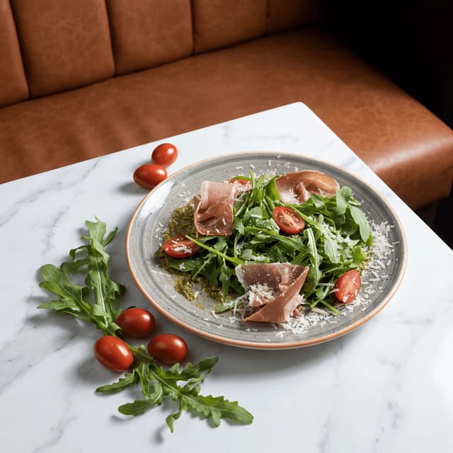 Jamón Ibérico and Manchego reception board on marble slab with olives and membrillo — Spanish wedding catering photography