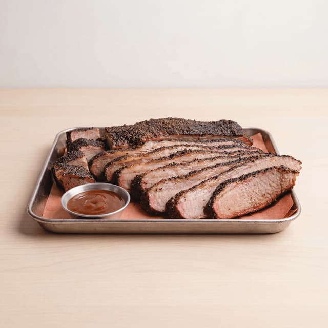 Texas smoked brisket sliced smoke ring bark butcher paper dallas bbq — brisket hero photography