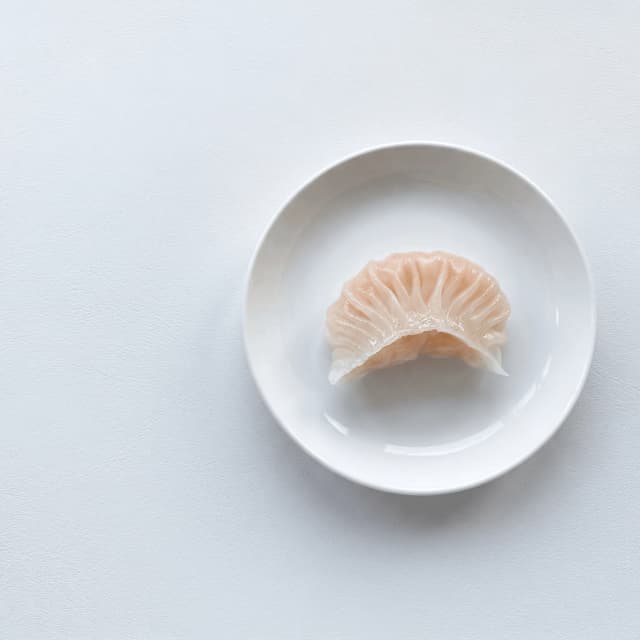 Single har gow crystal translucent skin pleats macro — har gow dumpling card photography