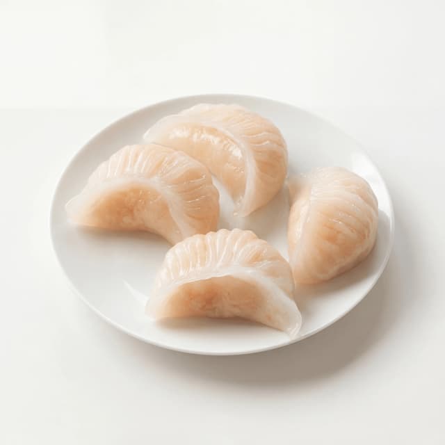 Har gow translucent crystal skin shrimp dumplings pleated — Cantonese har gow hero photography