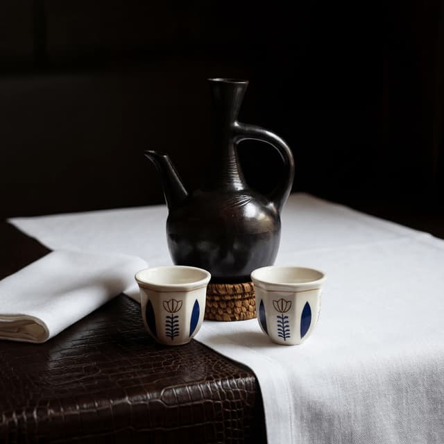 Ethiopian coffee ceremony jebena pot cups incense roasted beans — coffee ceremony hero photography