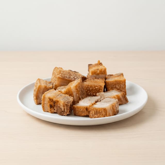 Lechon kawali filipino crispy pork belly cubes crackle skin liver sauce plate — lechon kawali hero photography