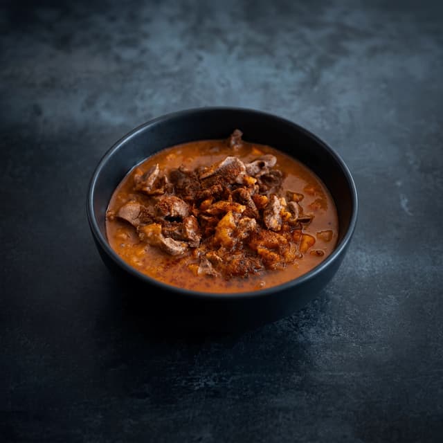 Bubbling Korean budae jjigae army stew with ramyeon and melted cheese — Korean restaurant review photography
