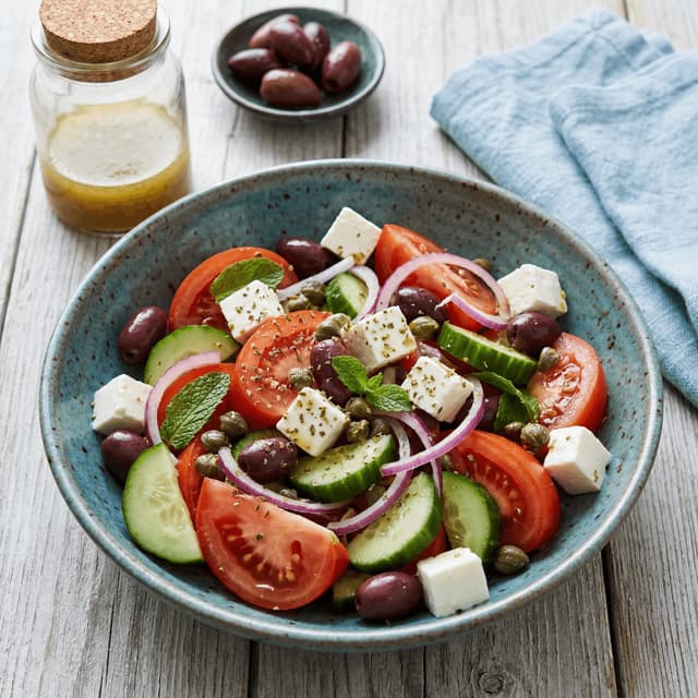 Greek horiatiki village salad tomato cucumber feta olives oregano — Greek salad hero photography