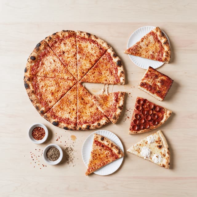 New york pizza spread wide thin slices whole pie pepperoni cups sicilian square white slice chili flake overhead light wood — nyc pizza card photography