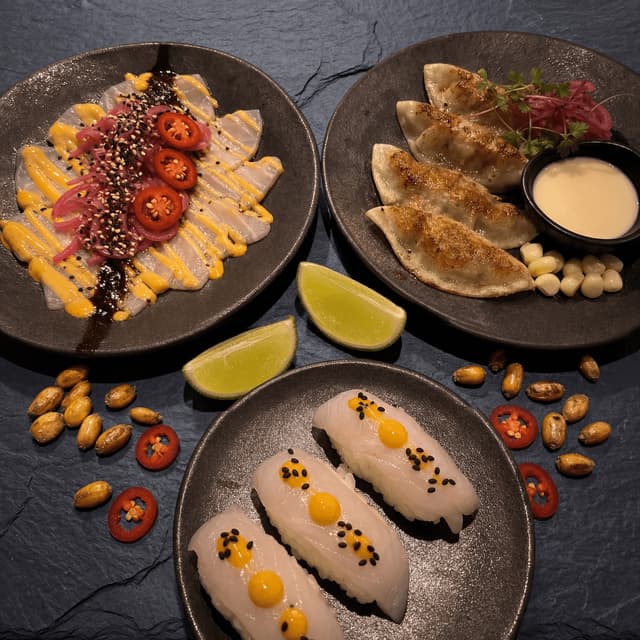 Nikkei tiradito sashimi style aji amarillo cream dark slate top down — Nikkei card photography