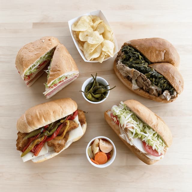 Philly hoagie spread italian hoagie roast pork broccoli rabe chicken cutlet seeded rolls overhead light wood — hoagie card photography