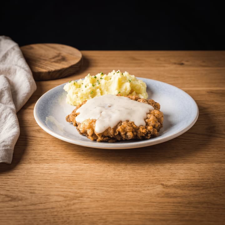 Chicken fried steak texas cream gravy crispy cutlet eggs macro plate dallas — chicken fried steak FAQ sidebar photography