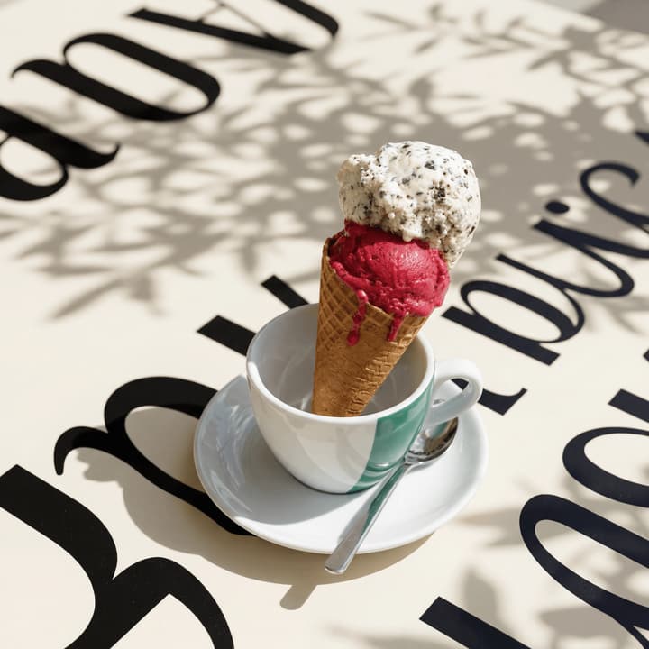 Double scoop gelato cone melting drip Italian gelateria — iconic ice cream photography sidebar