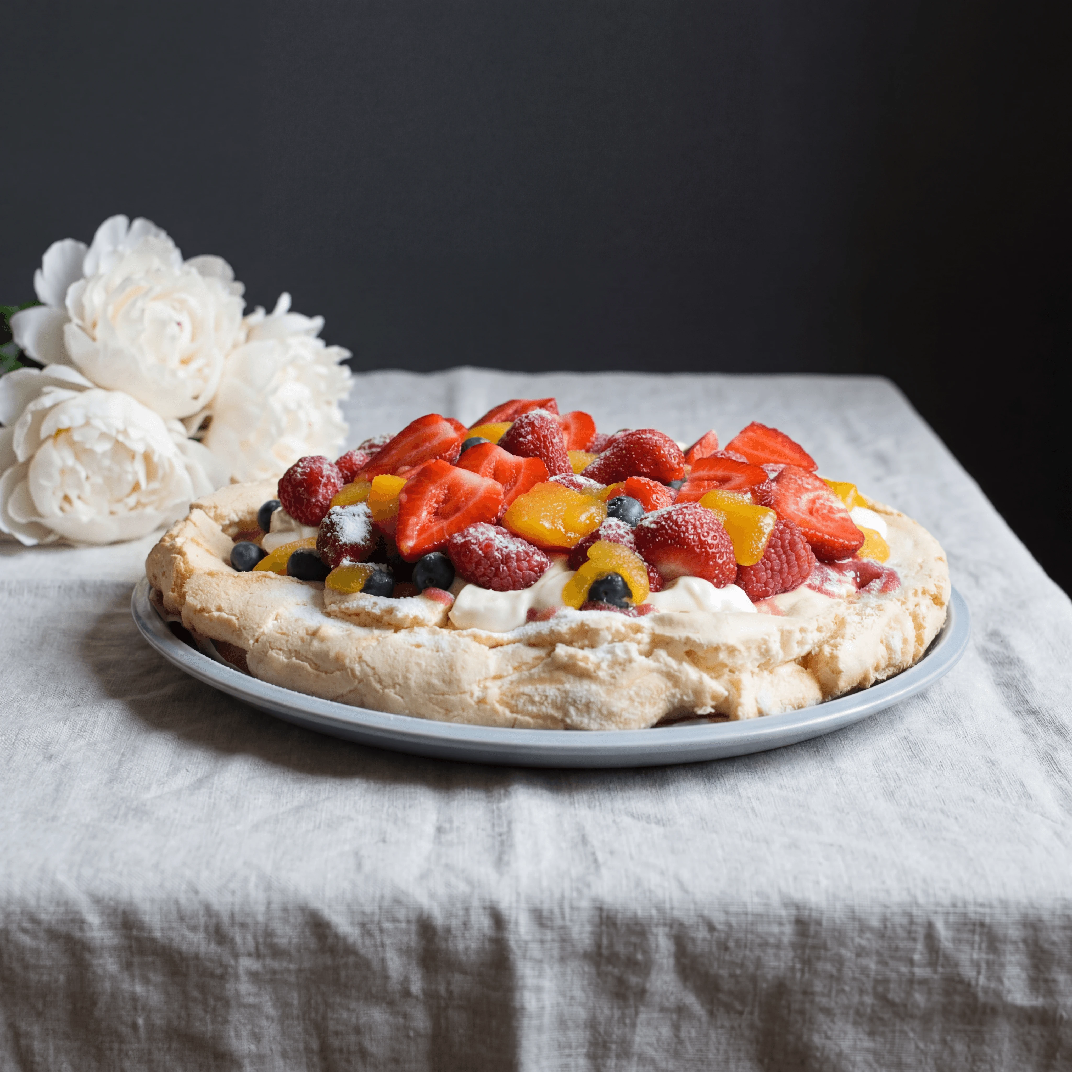 Whole pavlova platter with whipped cream and summer berries — pavlova cake photography