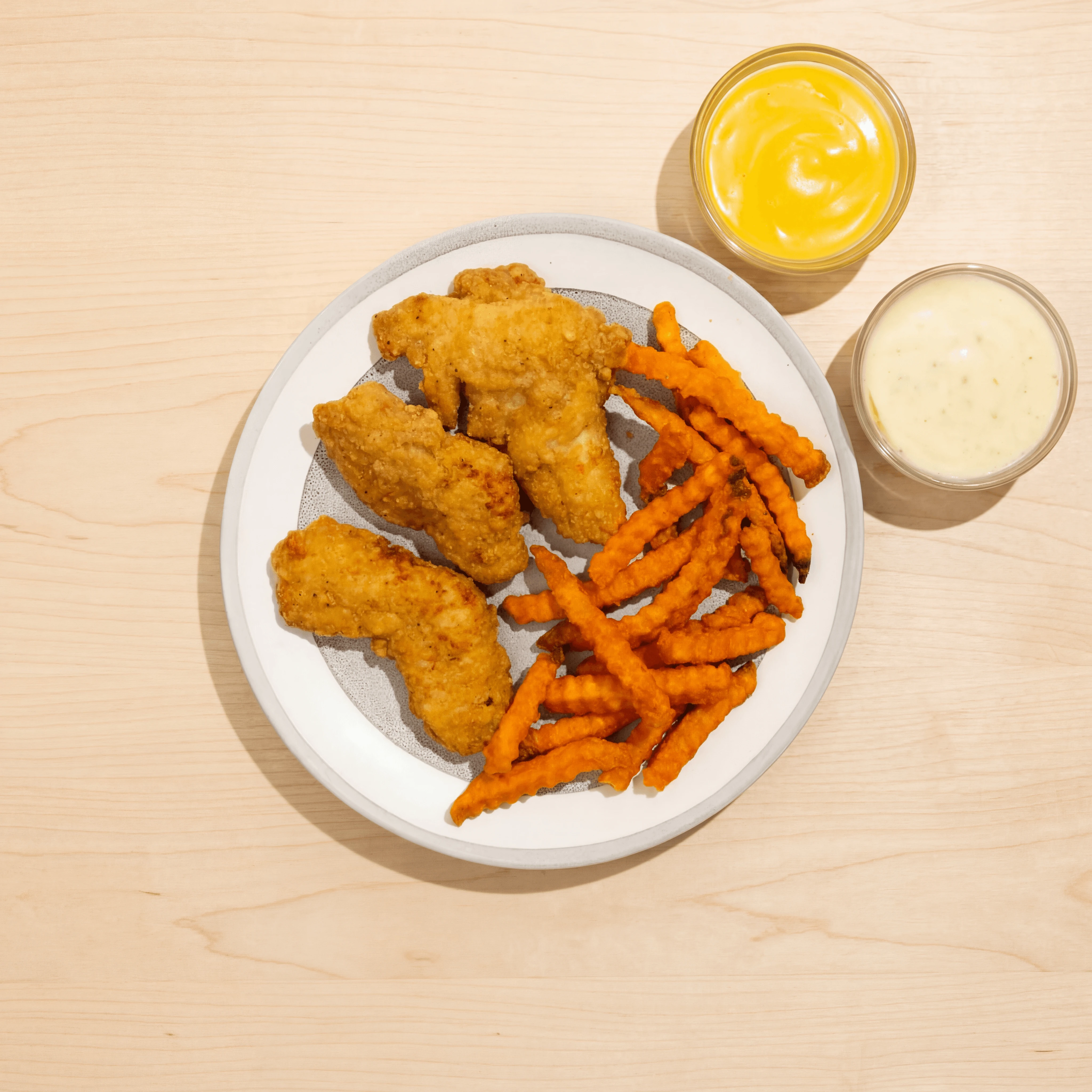 Chicken tenders sweet potato fries dipping sauces honey mustard ranch — fast casual chicken photography