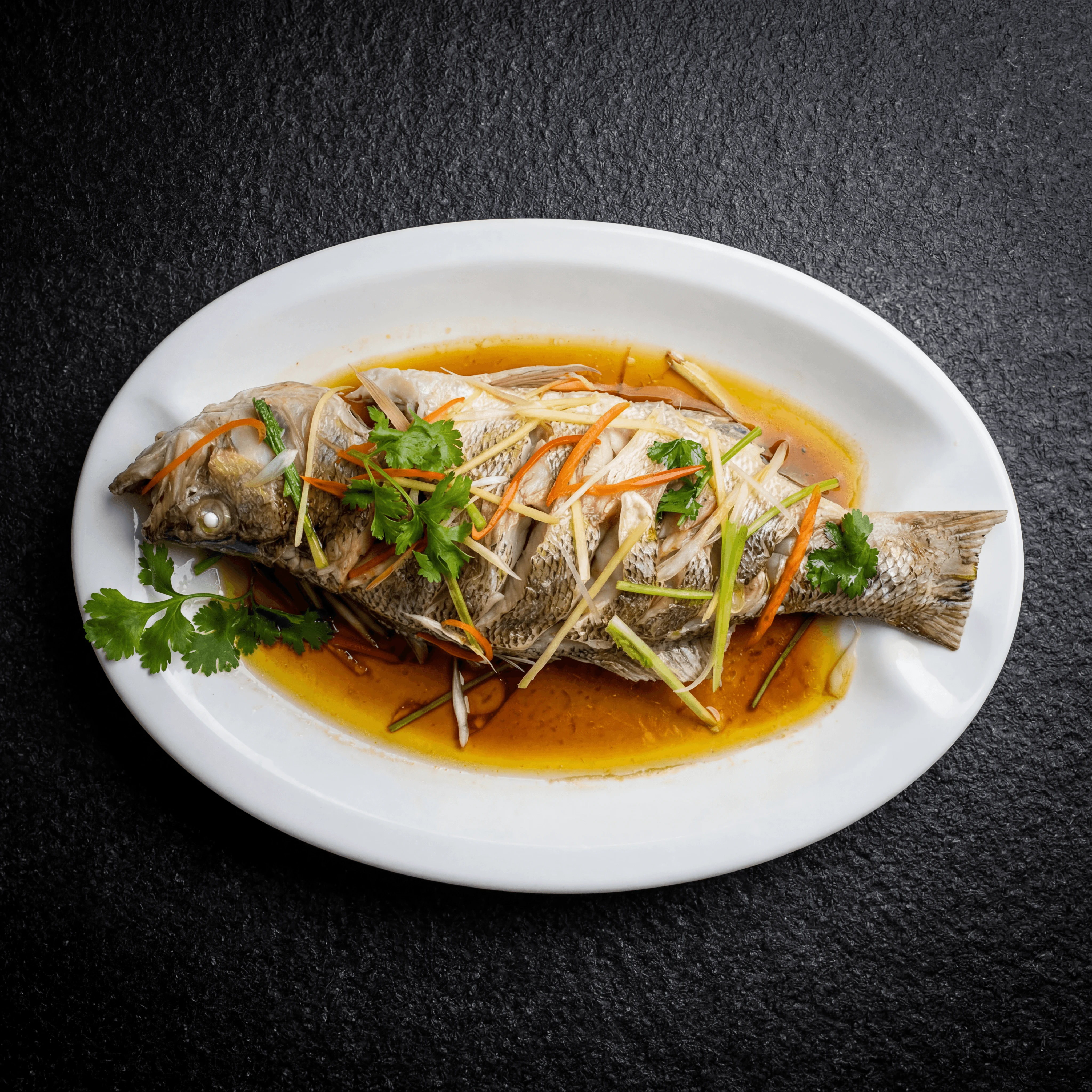 Cantonese steamed whole fish ginger scallion soy banquet platter — steamed fish FAQ sidebar photography