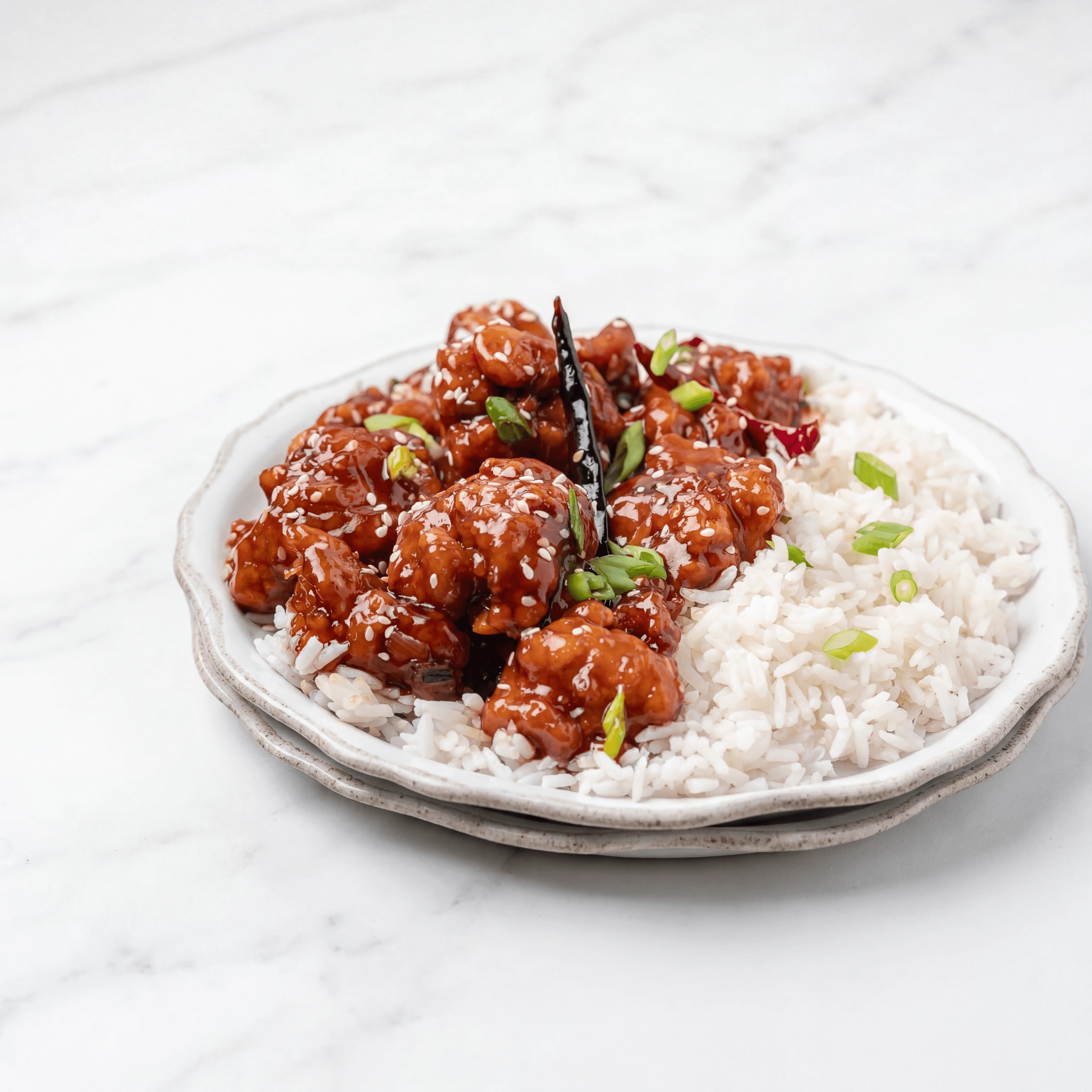 General Tso chicken glossy crimson glaze sesame broccoli rice — general tso hero photography