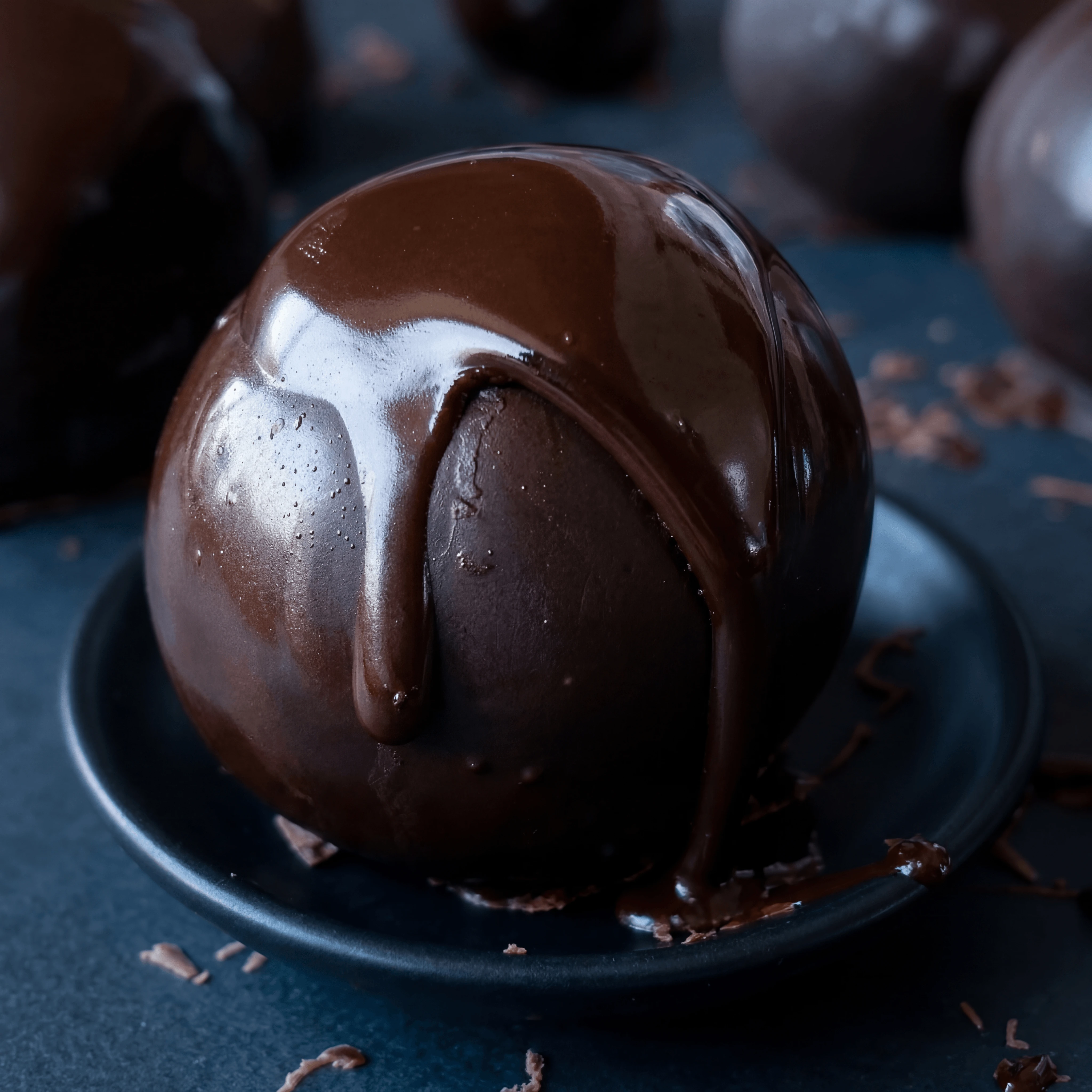 Glossy chocolate ganache drizzle pour fondant macro detail — ganache pour chocolatier card photography