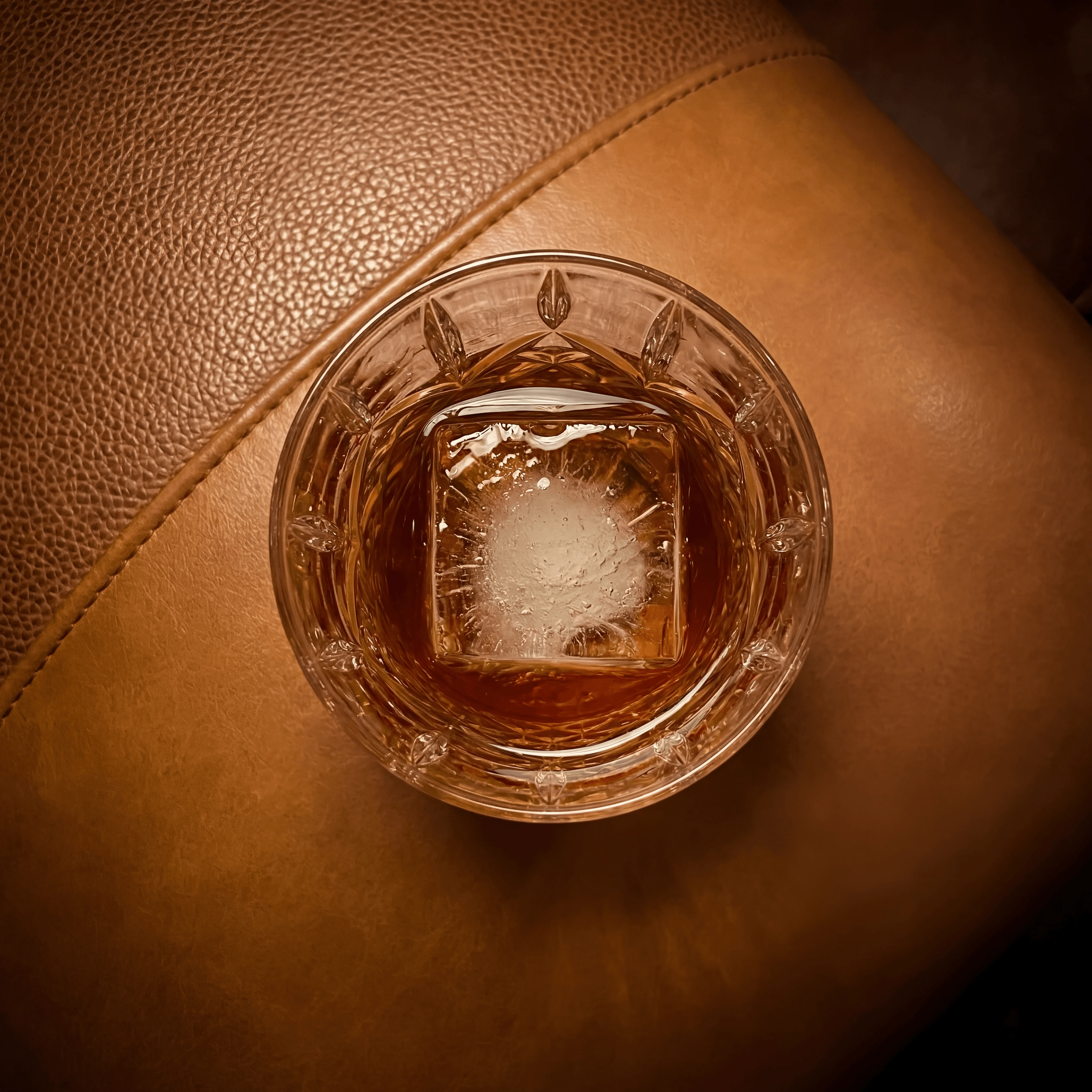Bourbon whiskey lowball glass leather lounge crystal ice — whiskey lowball card photography