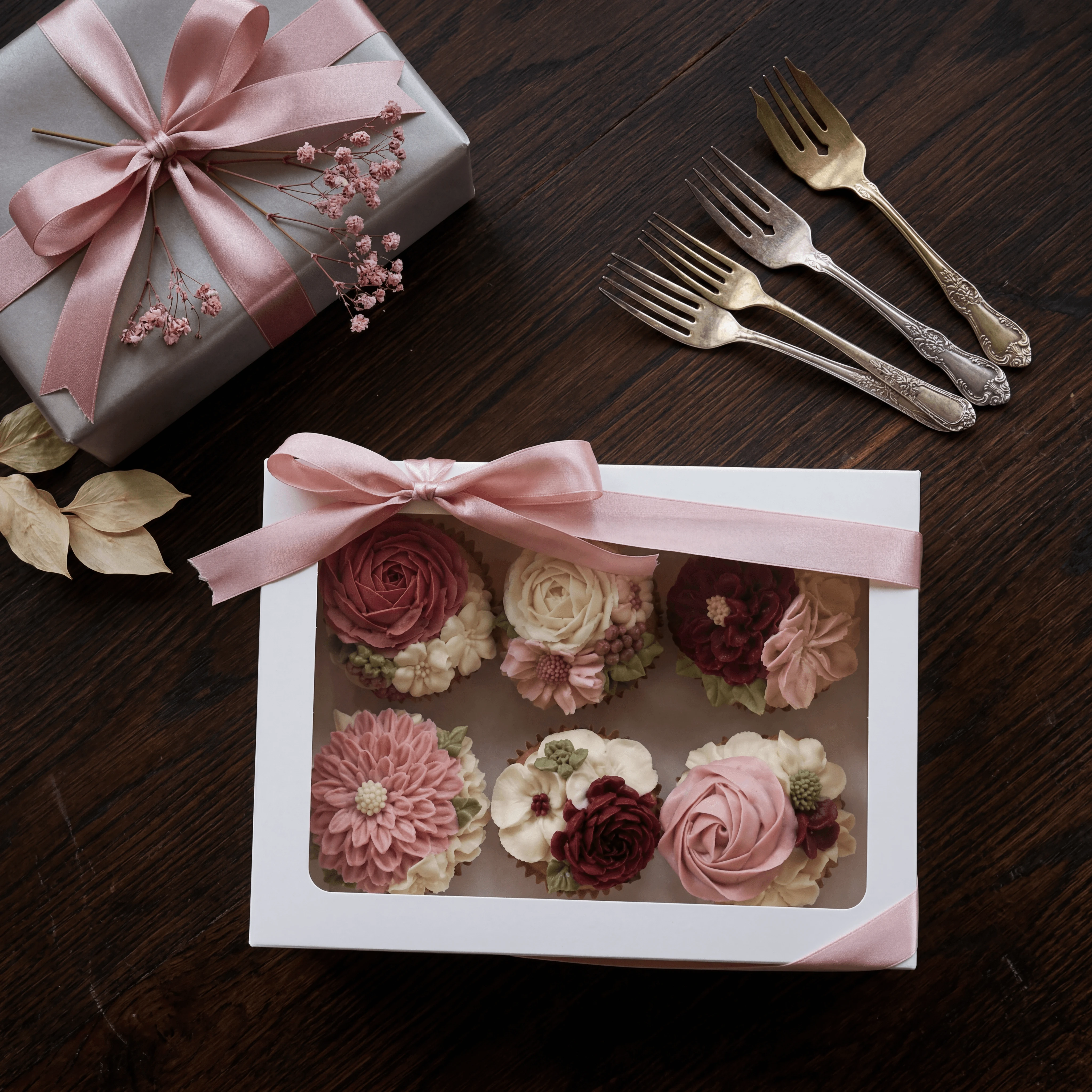 Floral buttercream cupcakes in white window gift box — boxed cupcake photography