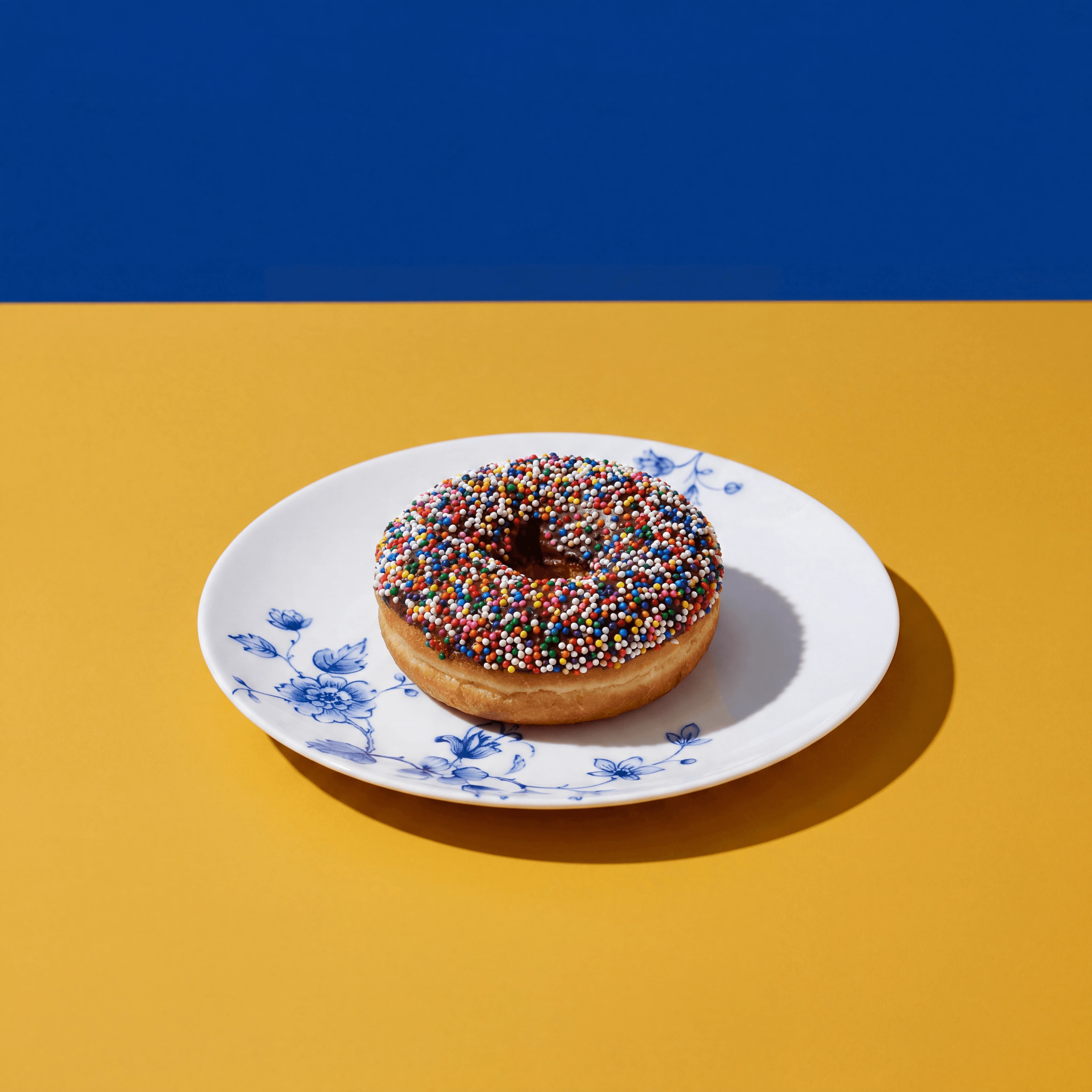 Rainbow sprinkles chocolate donut macro nonpareil — sprinkled donut card photography