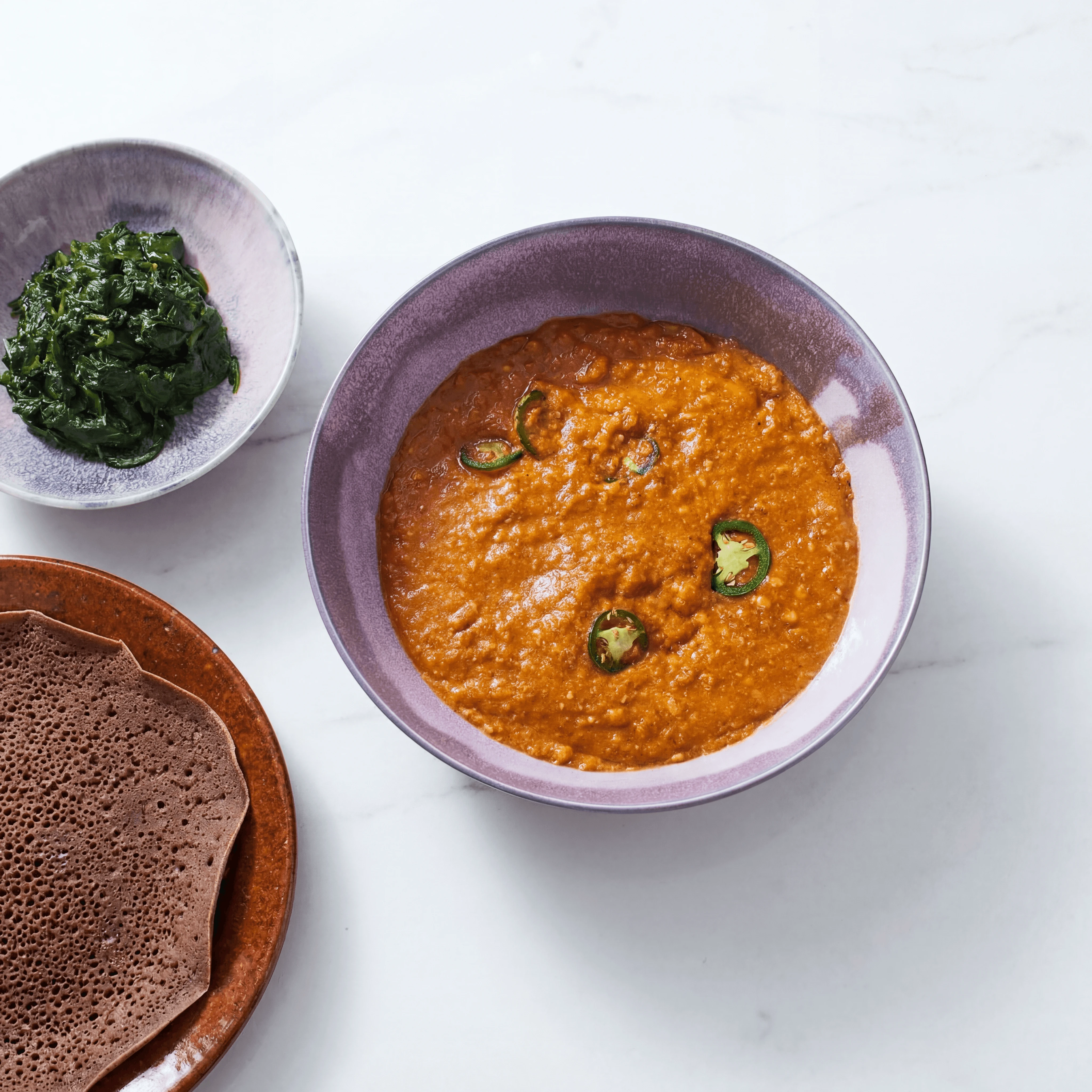 Ethiopian shiro chickpea stew golden clay bowl injera berbere — shiro hero photography