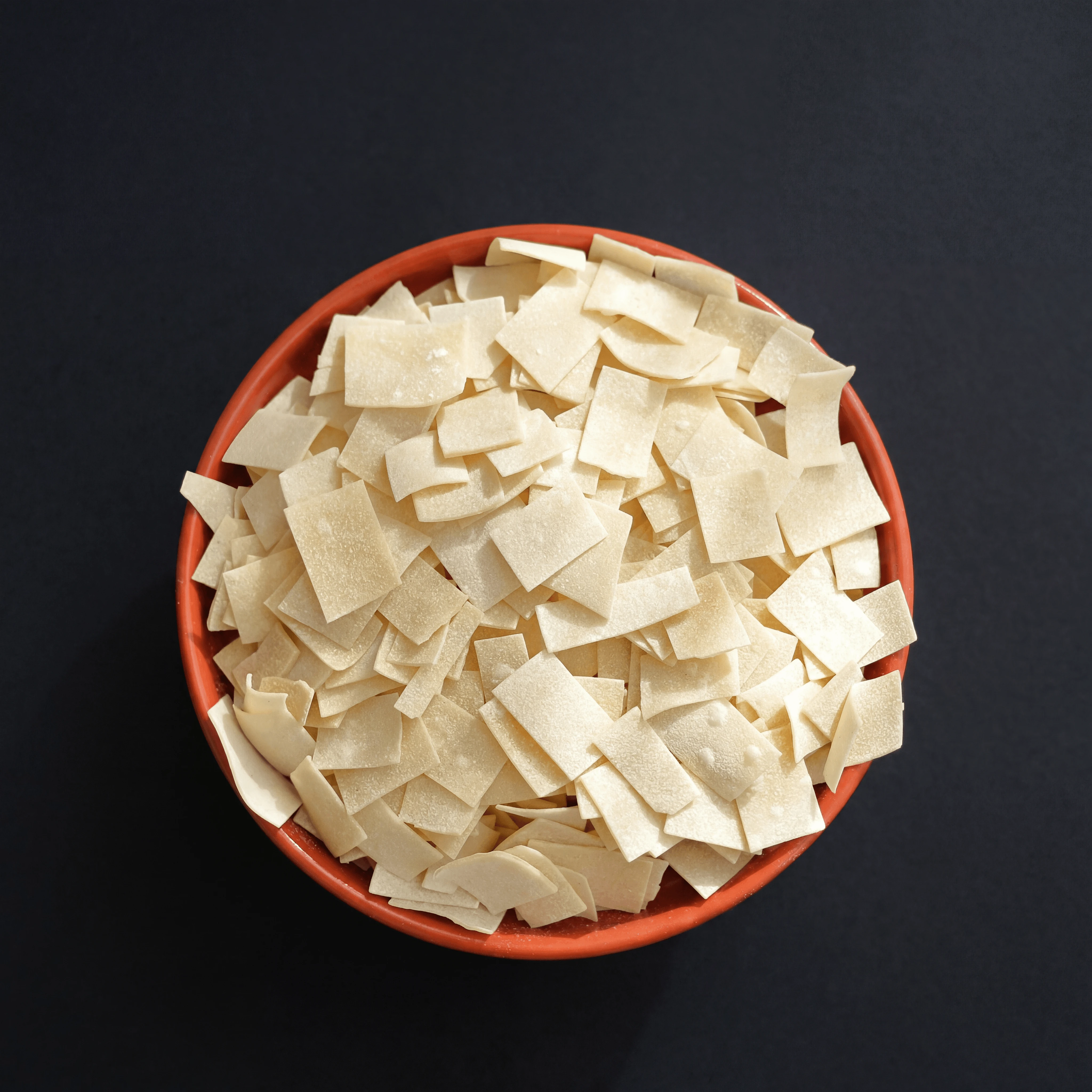 Bronze-die orecchiette pasta arranged for packaging design — Italian artisan pasta brand photography
