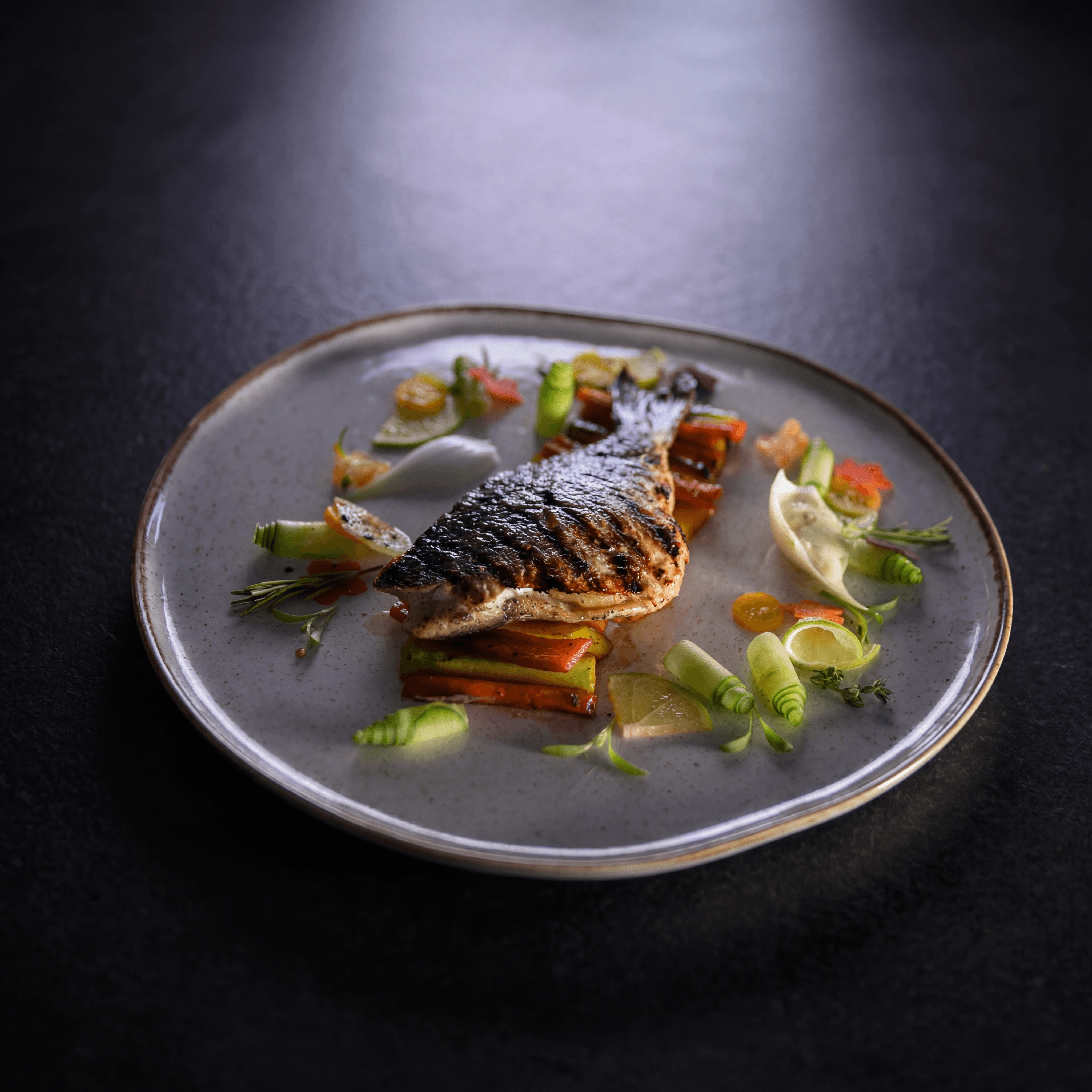 Charcoal-grilled Galician octopus with paprika oil — Spanish entrée for menu redesign consulting