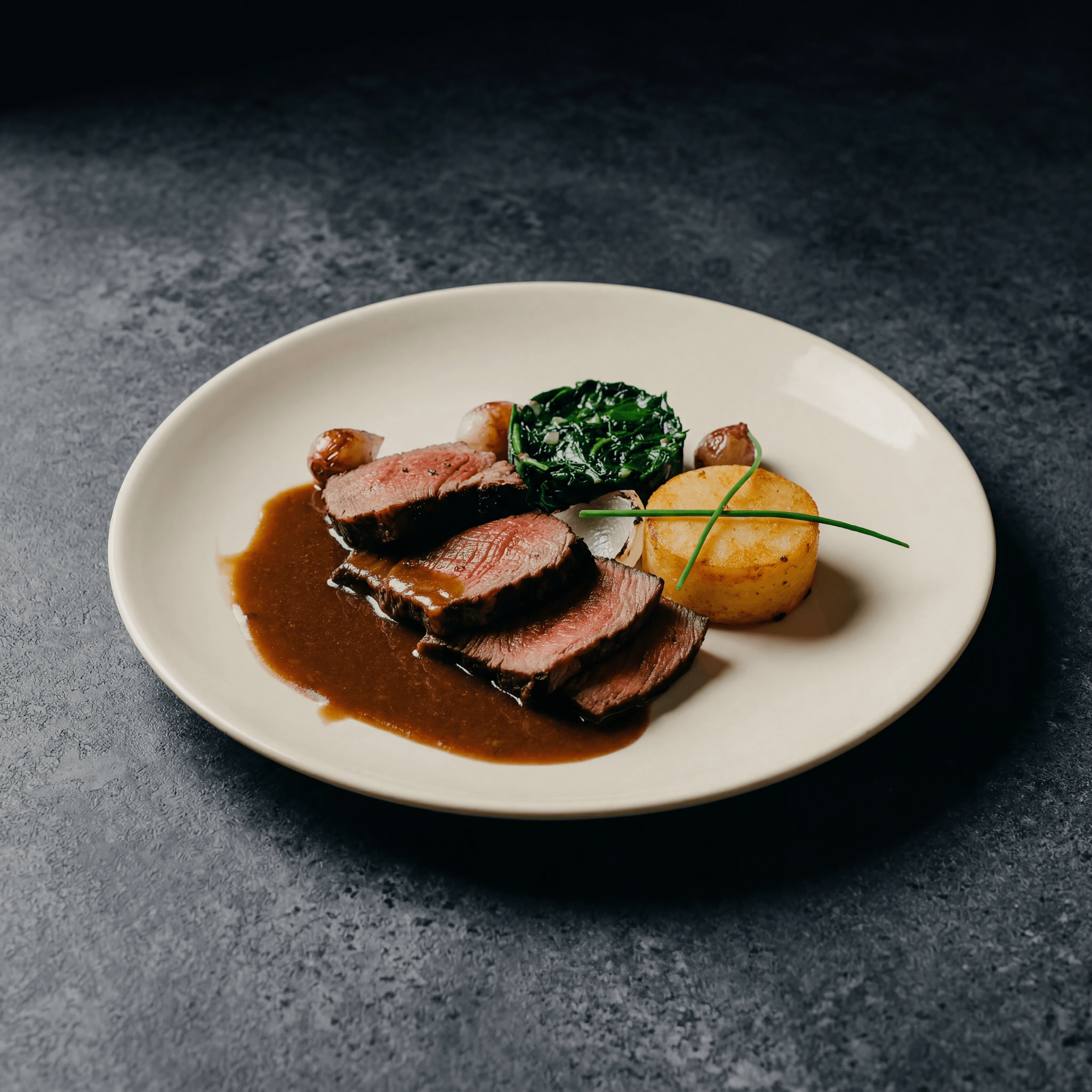 Sliced côte de boeuf with red wine jus and bone marrow — dramatic YouTube thumbnail food photography