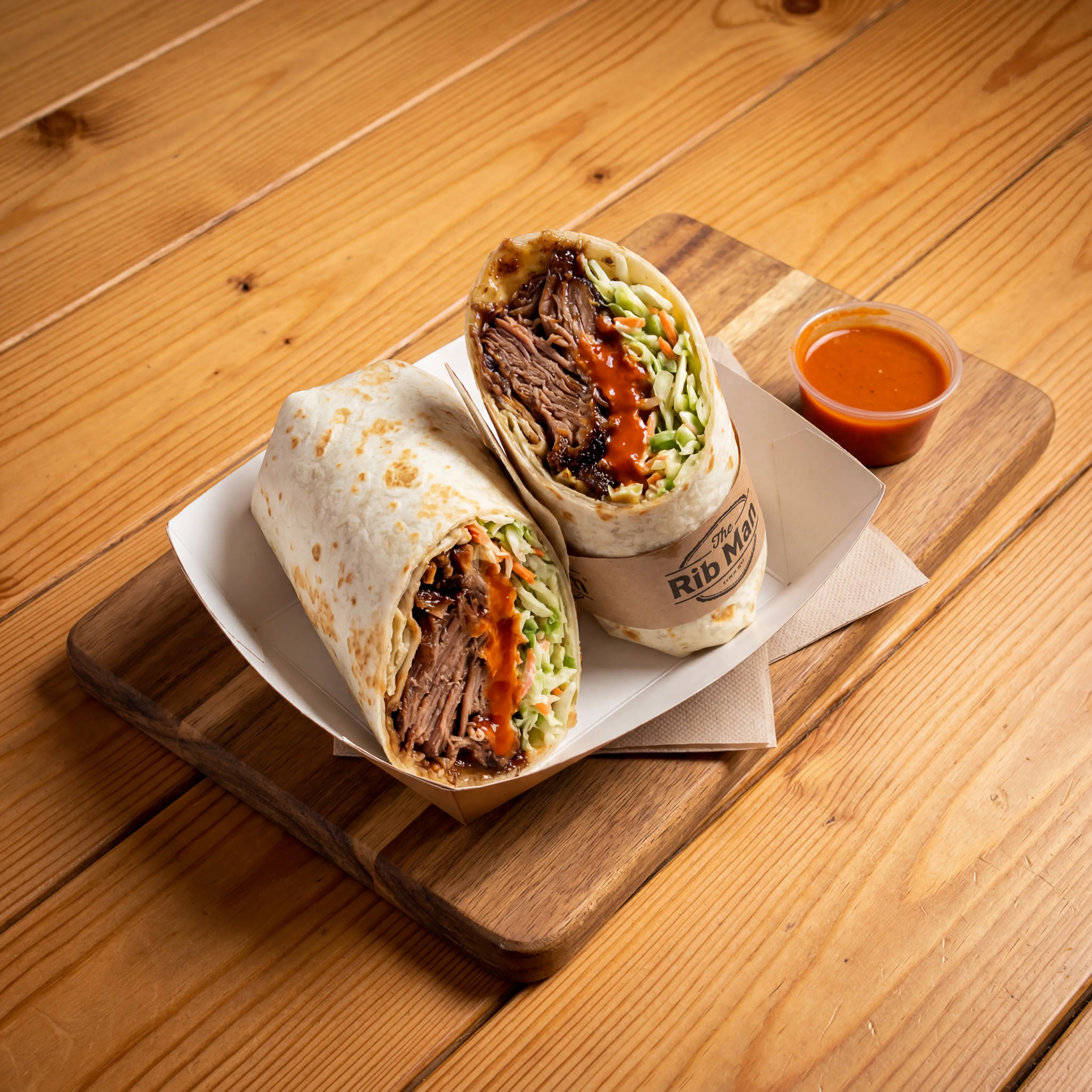 Slow-cooked rib meat wrap with hot sauce and coleslaw from The Rib Man in London