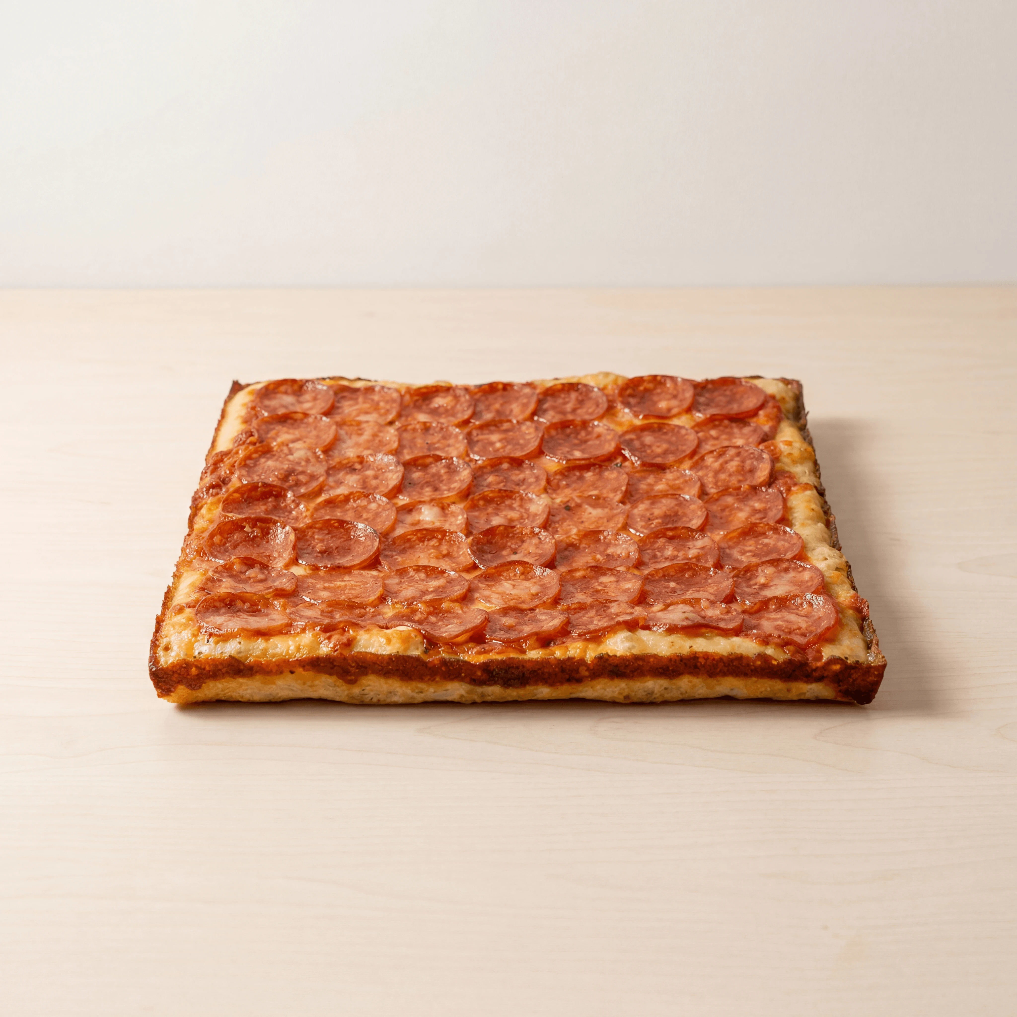 Detroit-style square pepperoni pizza — ghost kitchen pizza brand photography