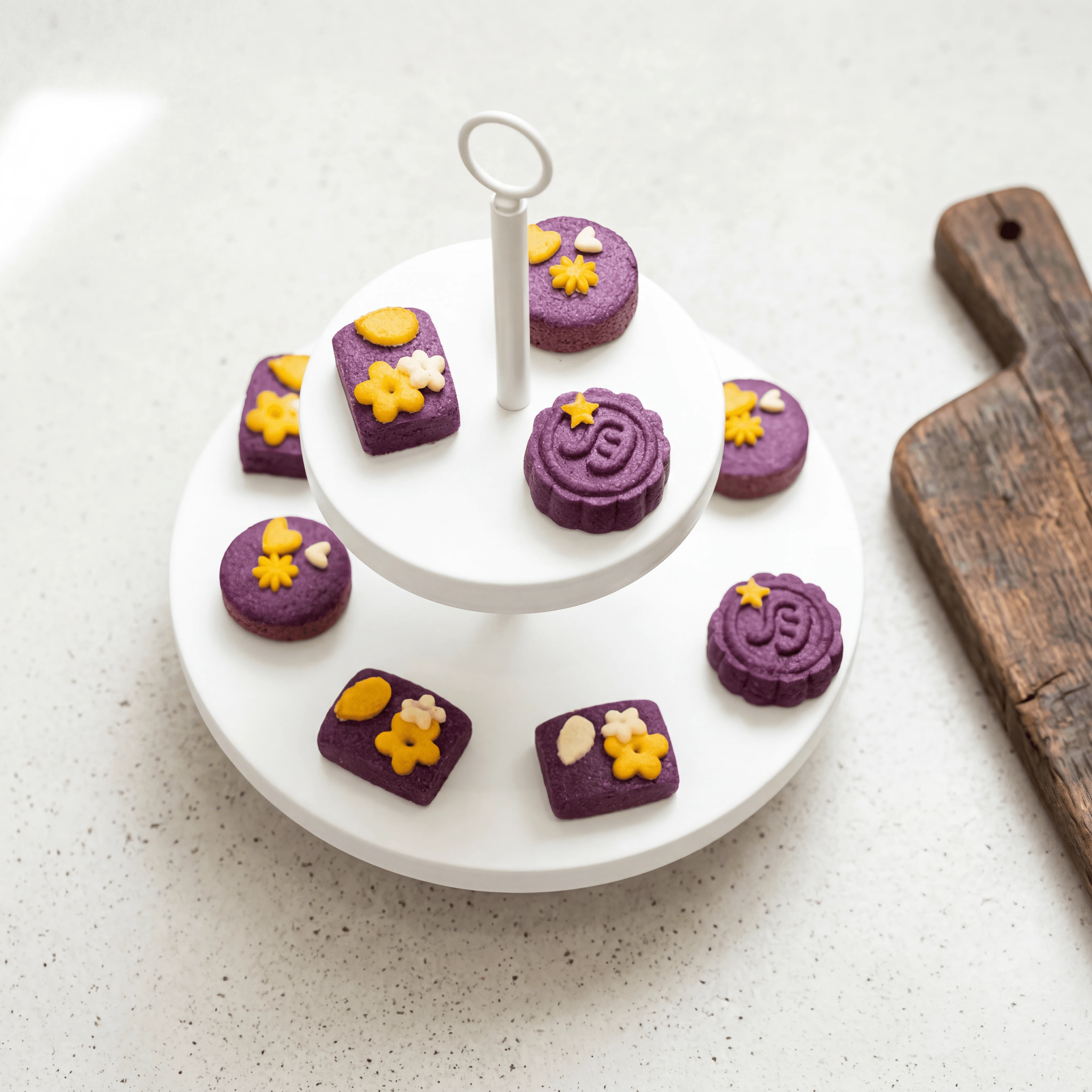 Three-tier afternoon tea stand with finger sandwiches and pastries — luxury hotel high tea photography