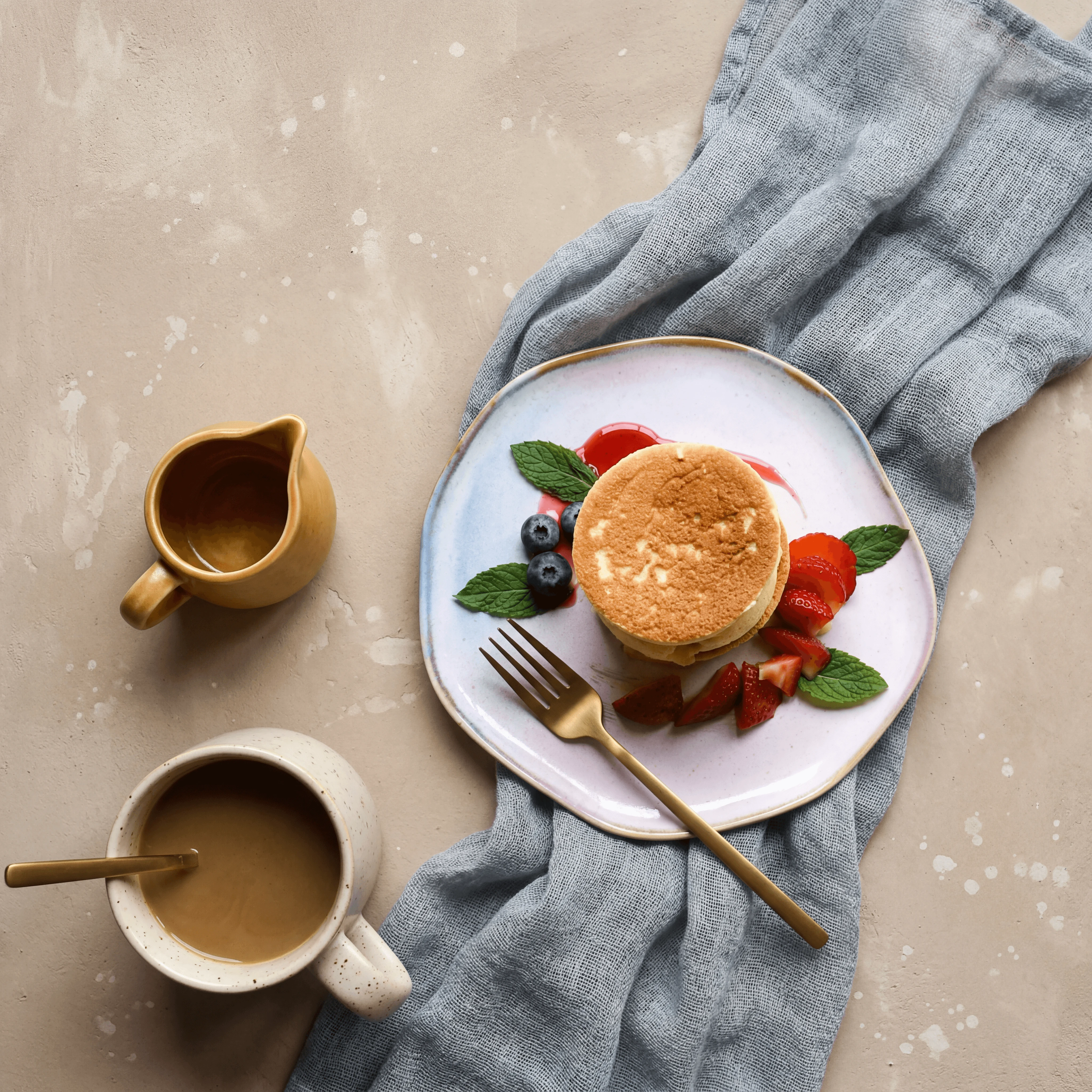 Moroccan baghrir thousand-hole pancakes with argan honey — hotel breakfast buffet photography