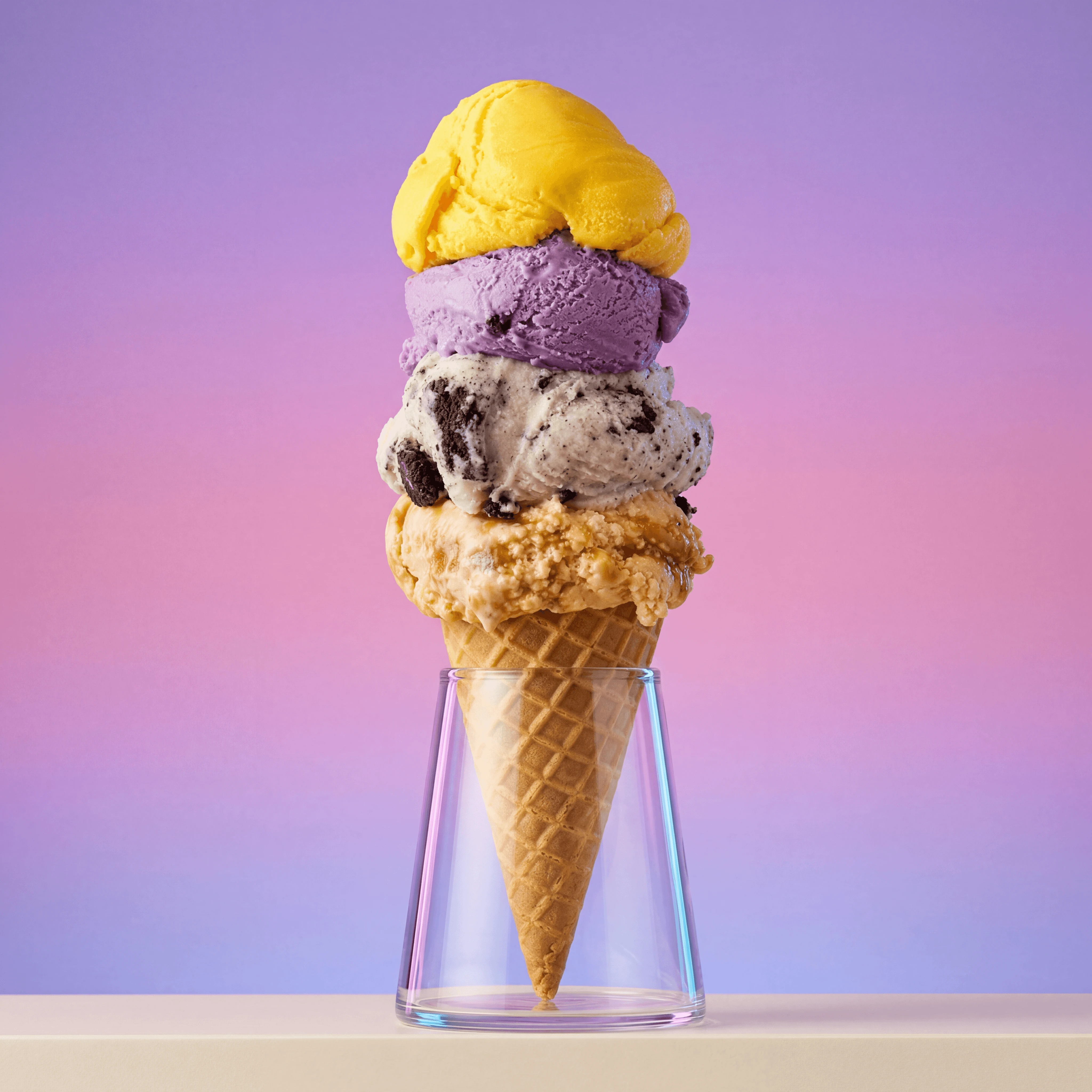 Quad scoop ice cream tower waffle cone four flavors — multi-flavor stack scoop shop card photography